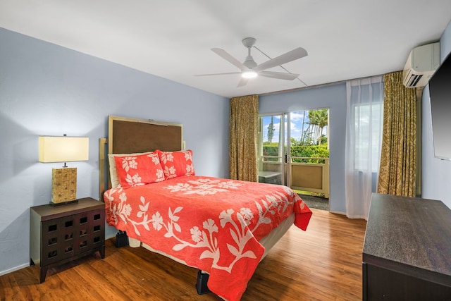 bedroom with a wall mounted air conditioner, wood finished floors, a ceiling fan, and access to outside