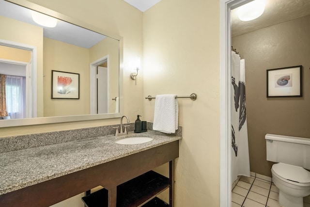 full bath featuring tile patterned flooring, toilet, and vanity