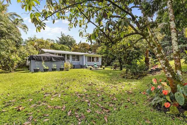 view of yard with a sunroom