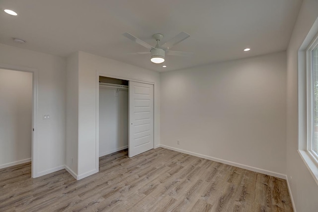 unfurnished bedroom featuring a ceiling fan, baseboards, recessed lighting, a closet, and light wood-type flooring