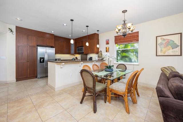 dining room with light tile patterned floors, recessed lighting, baseboards, and an inviting chandelier