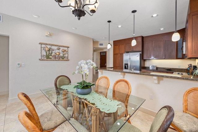 dining area featuring visible vents, recessed lighting, an inviting chandelier, light tile patterned floors, and baseboards