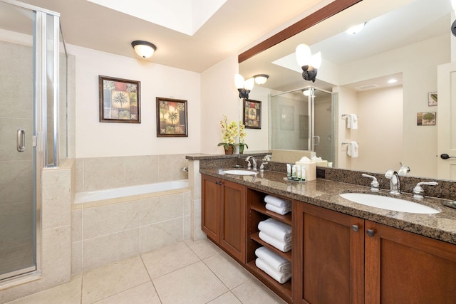 full bathroom featuring a sink, a bath, a shower stall, and tile patterned flooring