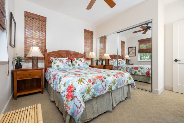 bedroom featuring baseboards, carpet, a closet, and ceiling fan