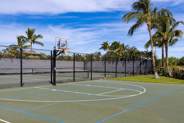 view of basketball court with community basketball court and fence