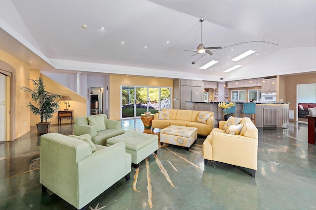 living area with high vaulted ceiling, finished concrete floors, and a ceiling fan