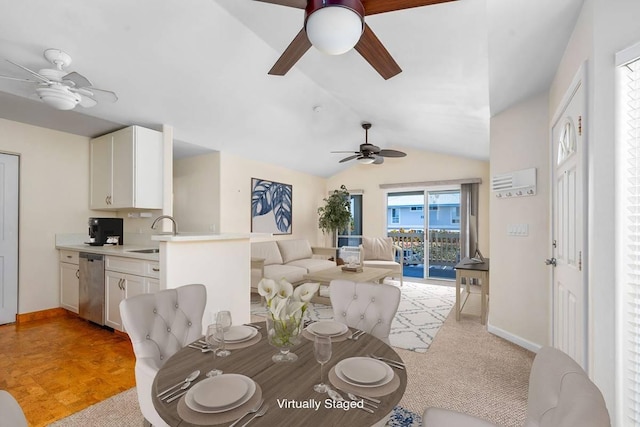 dining space with baseboards, a ceiling fan, and vaulted ceiling