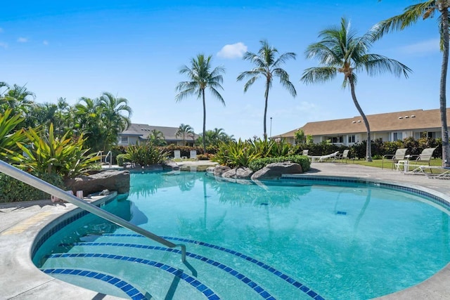 community pool with a patio area