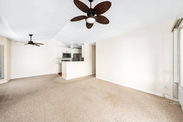 unfurnished living room featuring ceiling fan, vaulted ceiling, baseboards, and light carpet