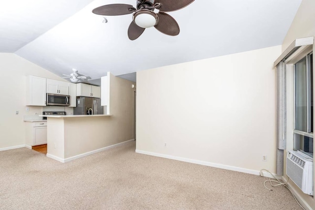 unfurnished living room with baseboards, lofted ceiling, light colored carpet, and ceiling fan