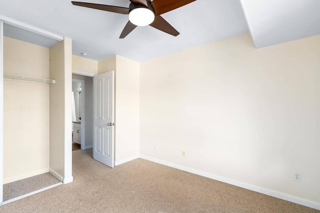 unfurnished bedroom with carpet flooring, baseboards, and ceiling fan