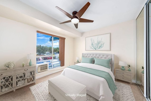 bedroom with a closet, cooling unit, a ceiling fan, and carpet