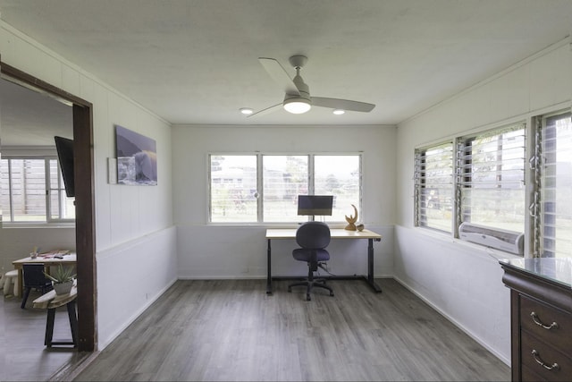 office space with ornamental molding, baseboards, a ceiling fan, and wood finished floors