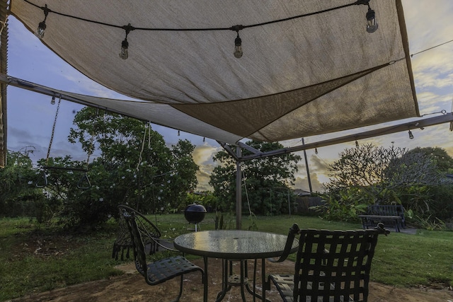 patio terrace at dusk with a yard