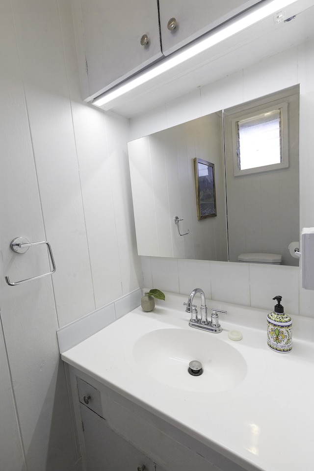 bathroom featuring toilet and vanity