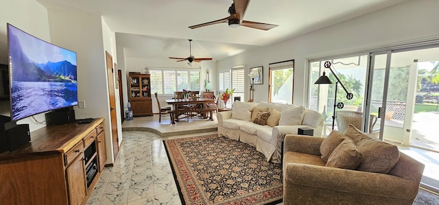 living area with lofted ceiling and a ceiling fan