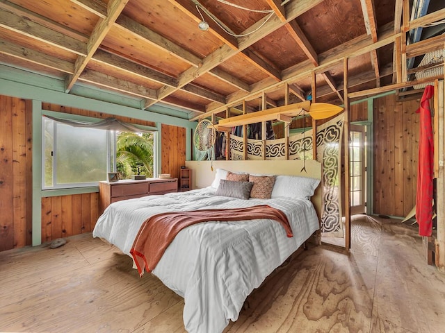 bedroom featuring wooden walls