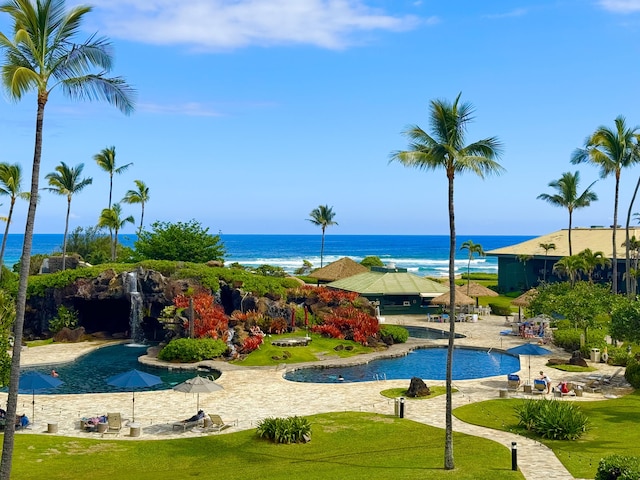 view of swimming pool featuring a water view
