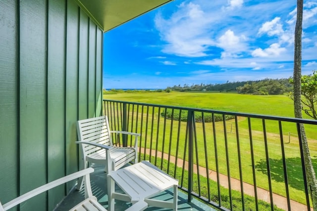 balcony featuring a rural view