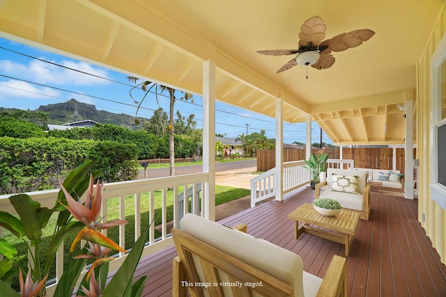 210 Eggerking Rd, Kapaa, HI 96746 - wooden terrace with an outdoor living space, ceiling fan, and covered porch