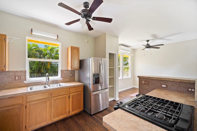 210 Eggerking Rd, Kapaa, HI 96746 - kitchen featuring stainless steel fridge, a sink, a ceiling fan, a wall mounted air conditioner, and dark wood finished floors