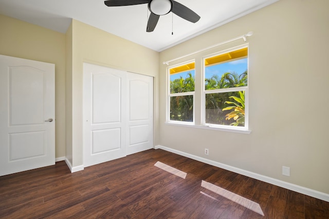 210 Eggerking Rd, Kapaa, HI 96746 - unfurnished bedroom with a closet, dark wood-type flooring, baseboards, and ceiling fan