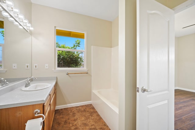 210 Eggerking Rd, Kapaa, HI 96746 - full bathroom with vanity, baseboards, and shower / tub combination
