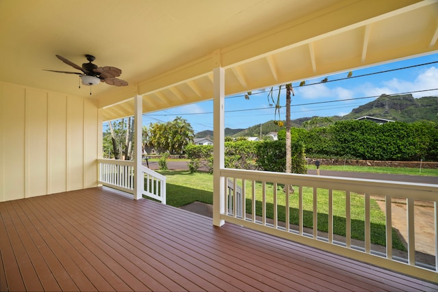 210 Eggerking Rd, Kapaa, HI 96746 - deck featuring a ceiling fan, a lawn, a porch, and a mountain view