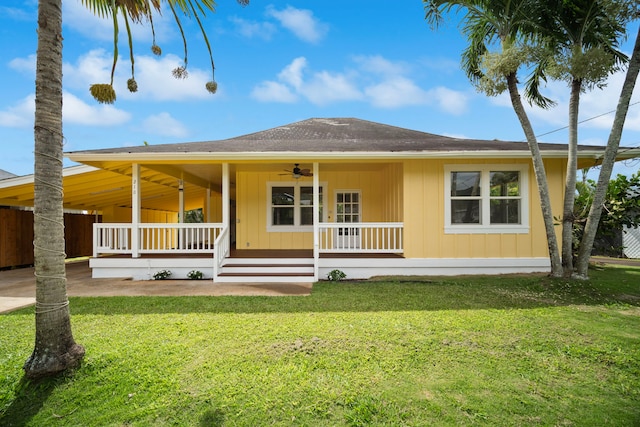 210 Eggerking Rd, Kapaa, HI 96746 - view of front of home with covered porch, a ceiling fan, a front lawn, and a carport
