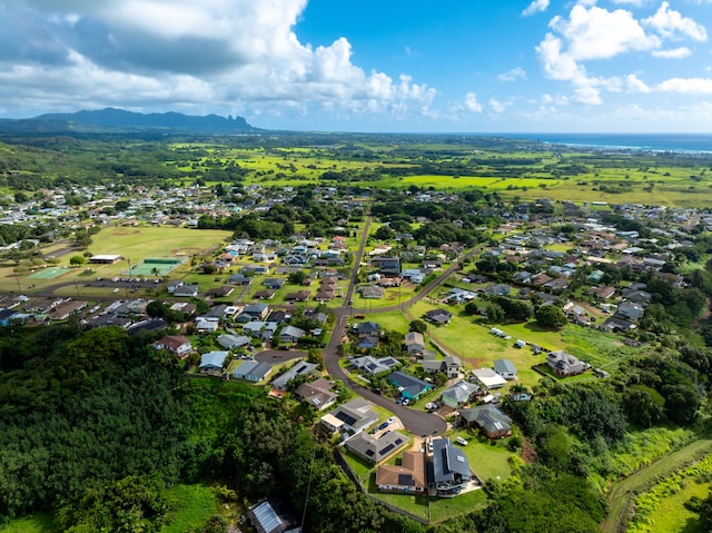 210 Eggerking Rd, Kapaa, HI 96746 - aerial view of property and surrounding area with nearby suburban area and a mountainous background