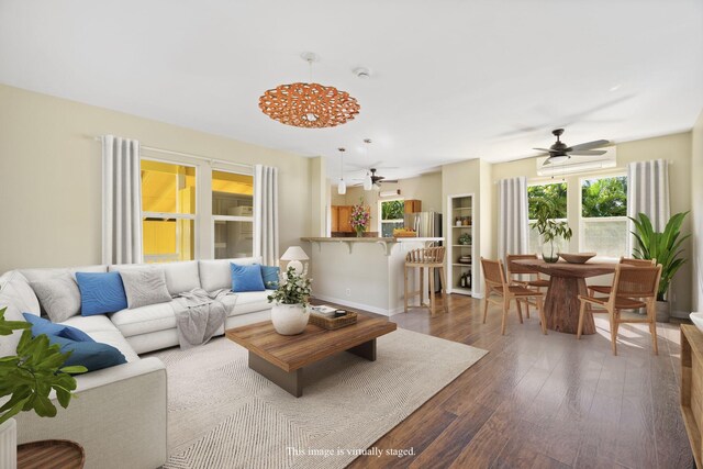 210 Eggerking Rd, Kapaa, HI 96746 - living room with ceiling fan and dark wood finished floors