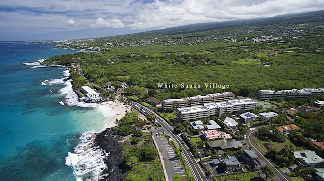 drone / aerial view with a view of the beach and a water view