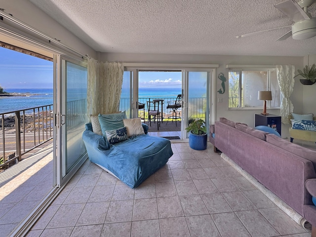 sunroom / solarium with a water view
