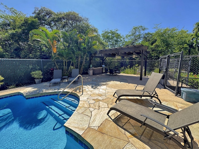 view of pool featuring a fenced in pool, fence, a pergola, and a patio