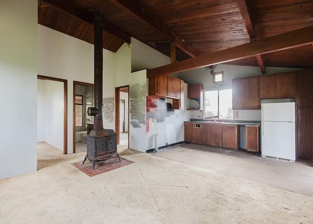 11-3169 Volcano Rd, Volcano, HI 96785 - kitchen with high vaulted ceiling, wooden ceiling, beam ceiling, freestanding refrigerator, and a wood stove
