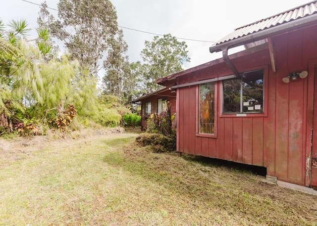 11-3169 Volcano Rd, Volcano, HI 96785 - exterior space featuring board and batten siding and a yard