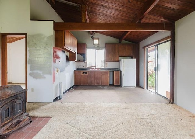 11-3169 Volcano Rd, Volcano, HI 96785 - kitchen featuring a wood stove, lofted ceiling with beams, wood ceiling, a sink, and freestanding refrigerator