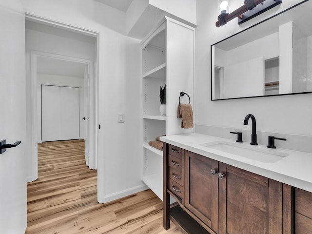 68-3831 Lua Kula St Unit C107, Waikoloa, HI 96738 - bathroom featuring wood finished floors, baseboards, and vanity