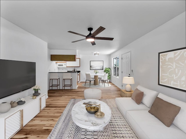 68-3831 Lua Kula St Unit C107, Waikoloa, HI 96738 - living area with light wood-style floors and ceiling fan