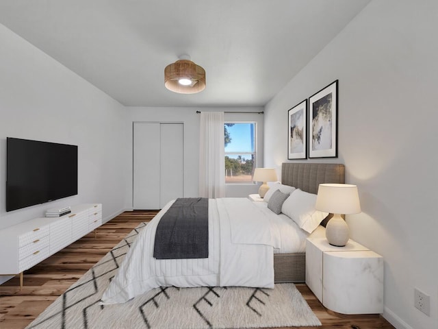 68-3831 Lua Kula St Unit C107, Waikoloa, HI 96738 - bedroom featuring wood finished floors, a closet, and baseboards