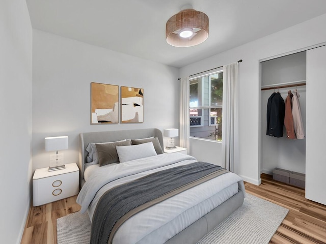 68-3831 Lua Kula St Unit C107, Waikoloa, HI 96738 - bedroom featuring wood finished floors, a closet, and baseboards