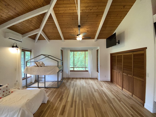 4631 Kahiliholo Rd, Kilauea, HI 96754 - unfurnished bedroom with beam ceiling, multiple windows, an AC wall unit, and light wood-type flooring