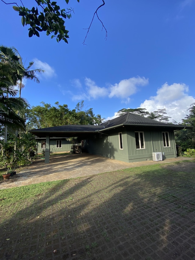 4631 Kahiliholo Rd, Kilauea, HI 96754 - view of side of property with a carport and driveway