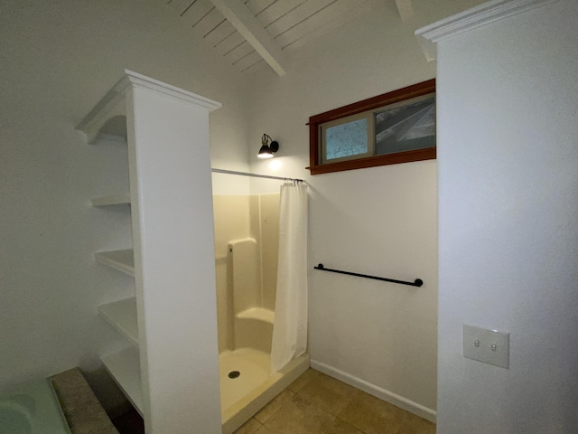 4631 Kahiliholo Rd, Kilauea, HI 96754 - bathroom with tile patterned floors, baseboards, a stall shower, and beam ceiling
