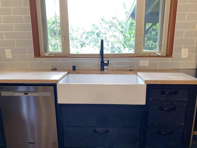 4631 Kahiliholo Rd, Kilauea, HI 96754 - kitchen with tasteful backsplash, blue cabinetry, dishwasher, and a sink