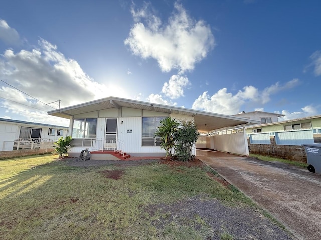 3172 Uluhui St, Lihue, HI 96766 - manufactured / mobile home with concrete driveway and an attached carport