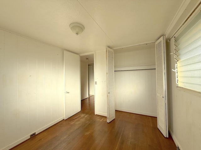 3172 Uluhui St, Lihue, HI 96766 - unfurnished bedroom featuring wood finished floors, a closet, and baseboards