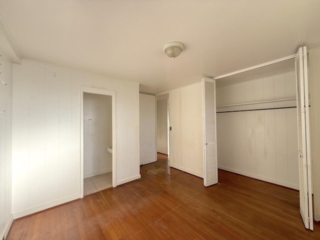 3172 Uluhui St, Lihue, HI 96766 - unfurnished bedroom featuring wood finished floors, a closet, and baseboards