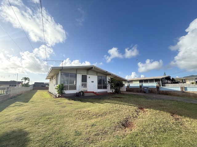 3172 Uluhui St, Lihue, HI 96766 - manufactured / mobile home with driveway and a sunroom