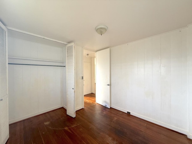 3172 Uluhui St, Lihue, HI 96766 - unfurnished bedroom with hardwood / wood-style floors, a closet, and baseboards